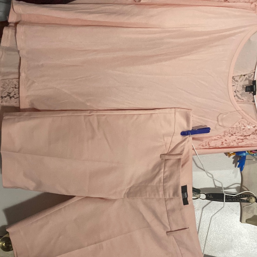 Peach short set with lace inserts. Blouse is a high low style